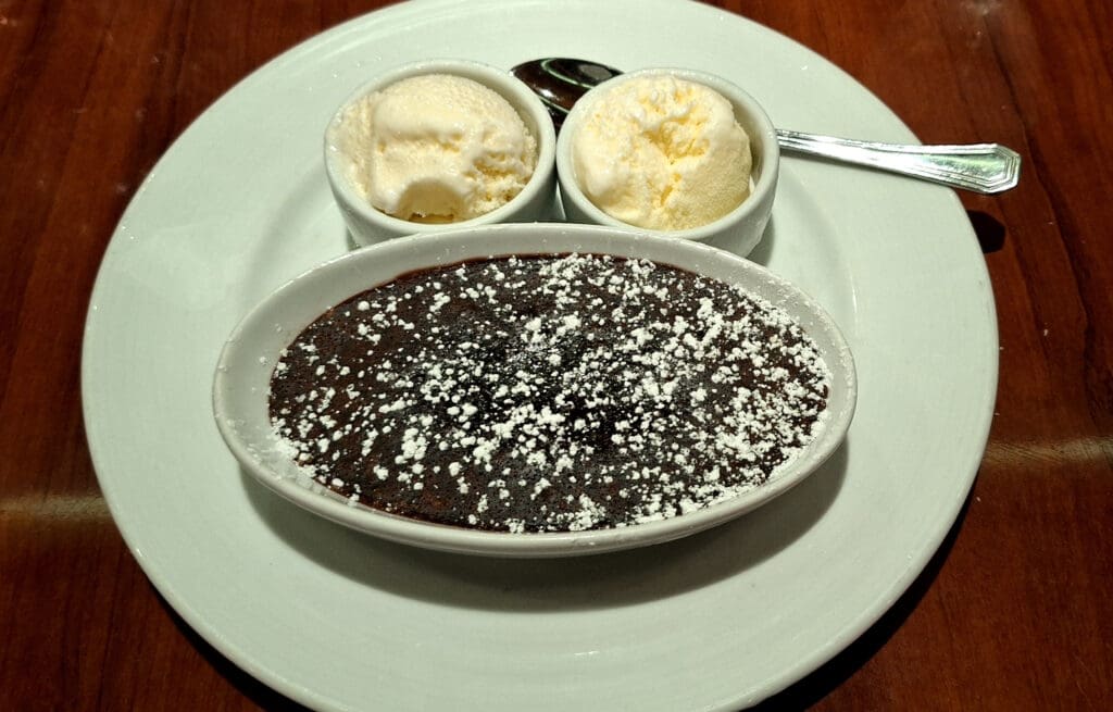 a plate of dessert with scoops of ice cream