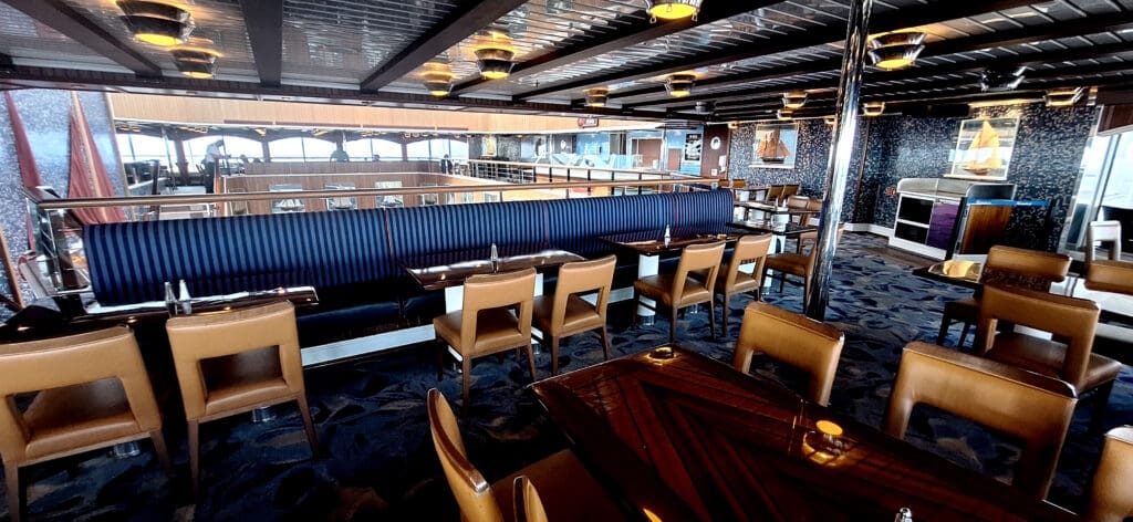 a restaurant with blue and white striped seats