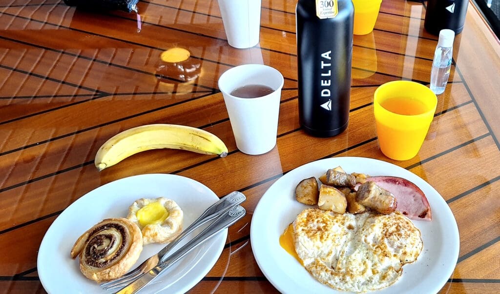 a plate of food and a drink on a table