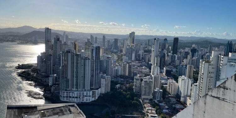 a city with many tall buildings and a body of water