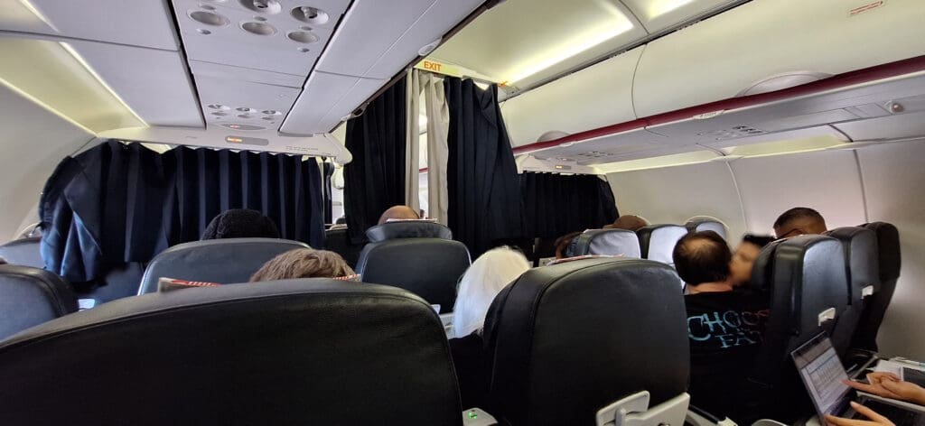 a group of people sitting in an airplane