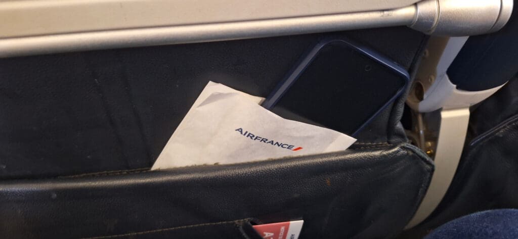 a phone and envelope in a pocket