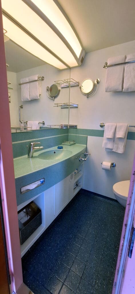 a bathroom with a sink and towels