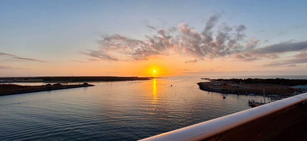 a sunset over a body of water