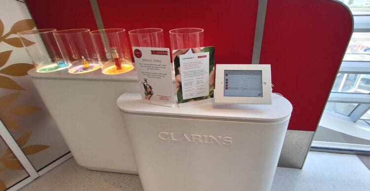 a white counter with a tablet and glasses on it