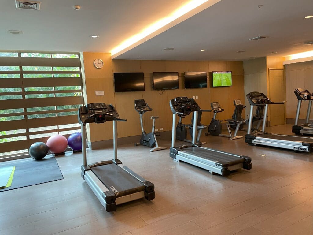 a room with treadmills and exercise equipment