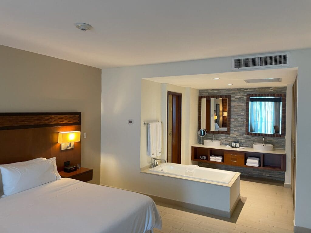 a room with a bed and bathtub