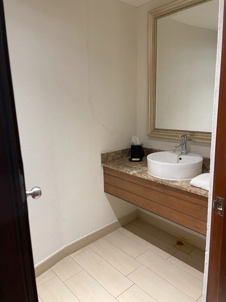 a bathroom with a sink and mirror