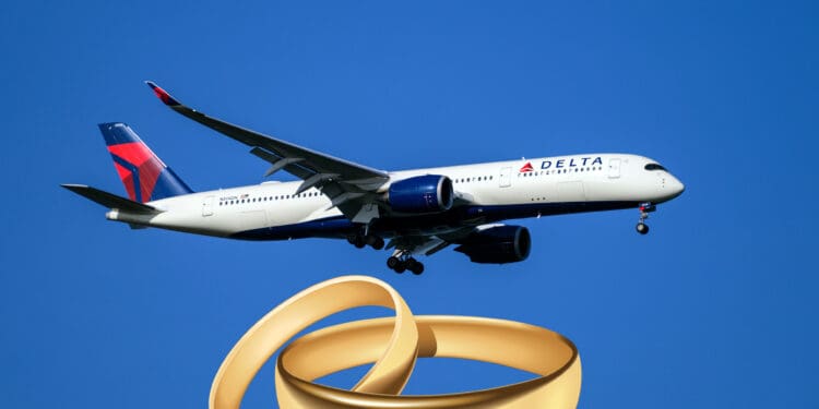 a plane flying in the sky with a wedding ring