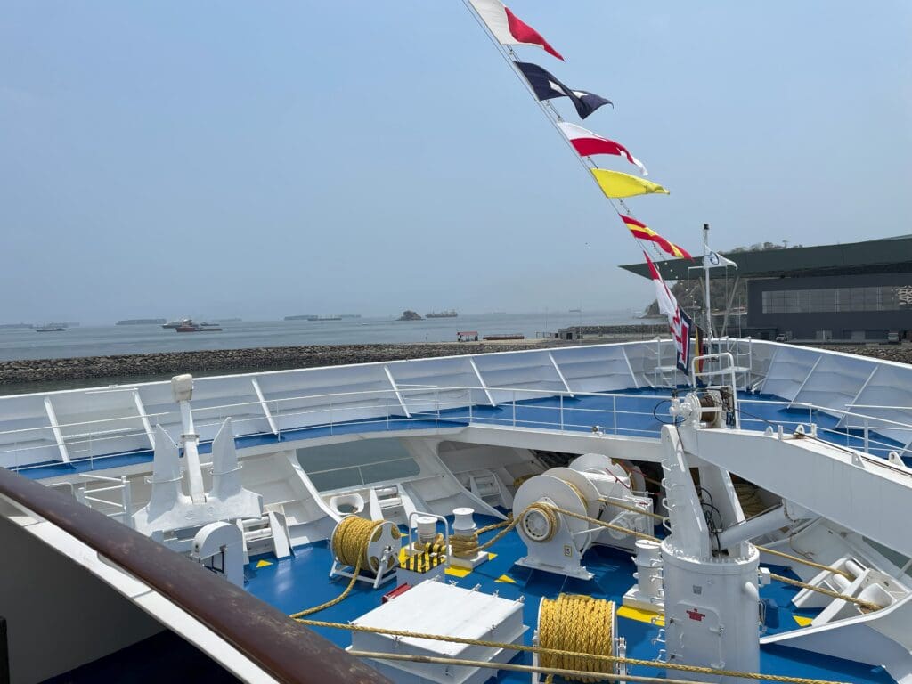 a boat with flags on the deck