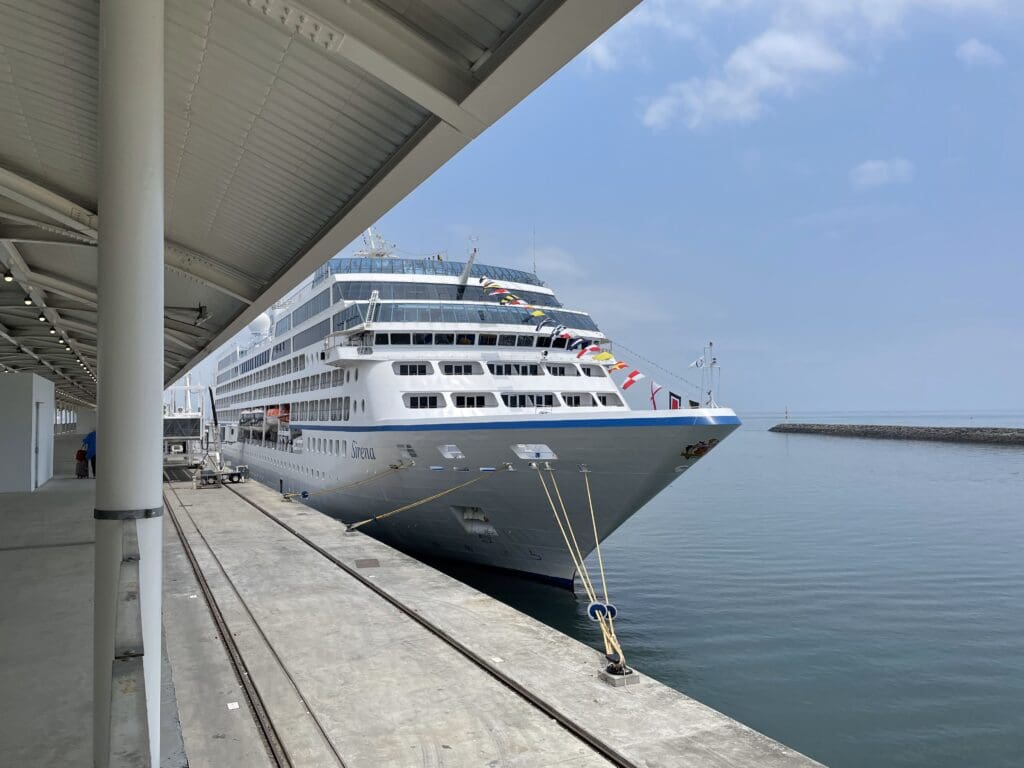 a cruise ship docked at a dock