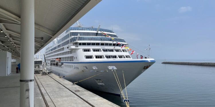 a cruise ship docked at a dock