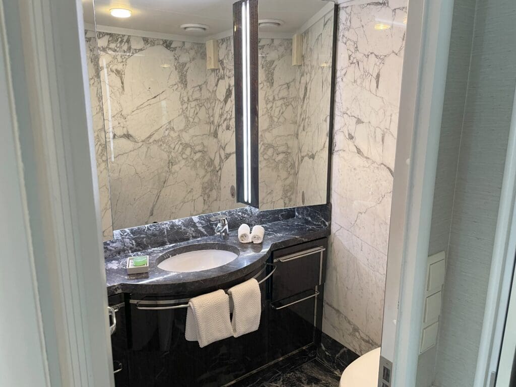 a bathroom with a mirror and sink