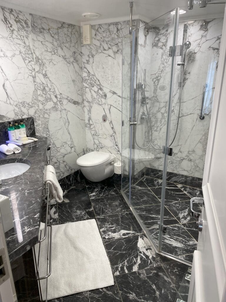 a bathroom with a sink and shower