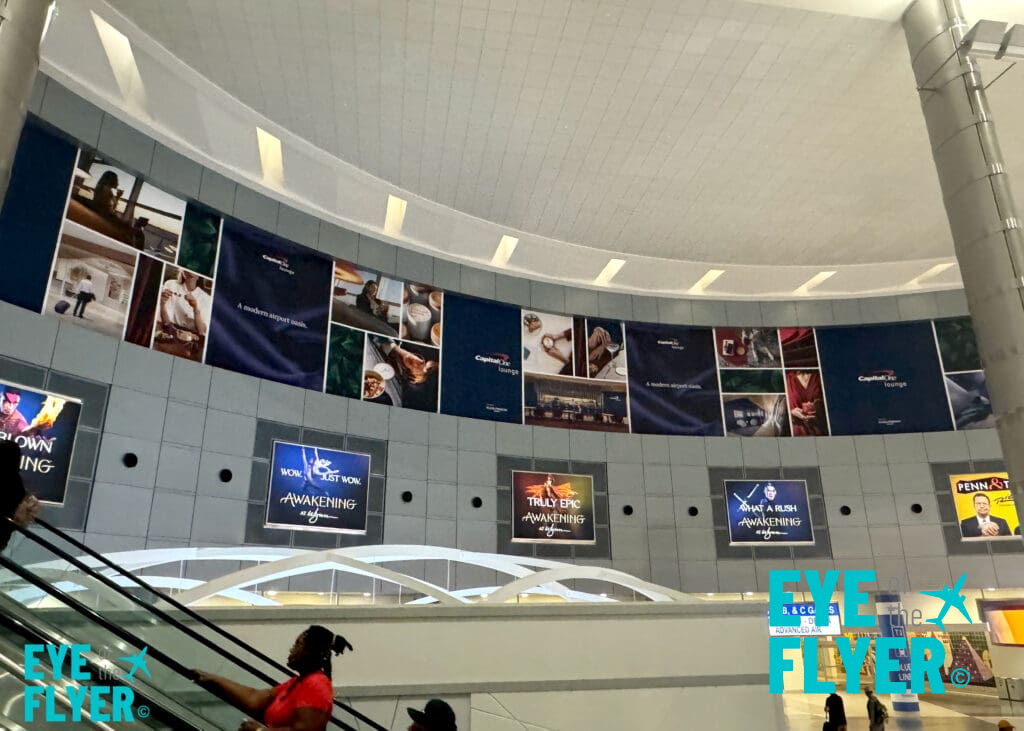 Branding for the Capital One Lounge inside Terminal 1's D-gate rotunda at Harry Reid International Airport (LAS) in Las Vegas.