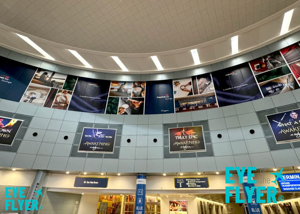 Branding for the Capital One Lounge inside Terminal 1's D-gate rotunda at Harry Reid International Airport (LAS) in Las Vegas.