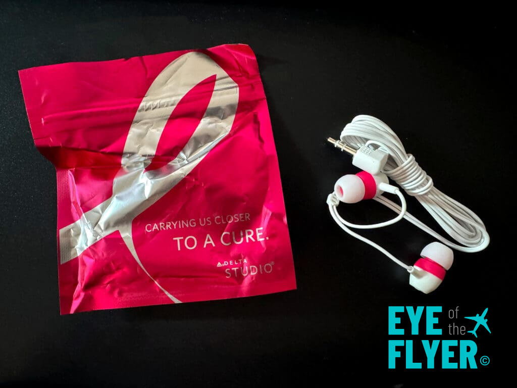 Commemorative ear buds provided by Delta Air Lines in honor of breast cancer awareness.