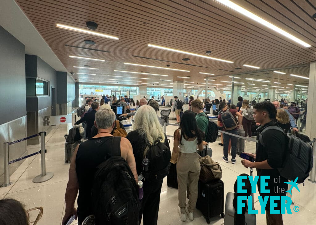 Passengers wait for another scan after initially being cleared in the CLEAR line at Denver International Airport (DEN)