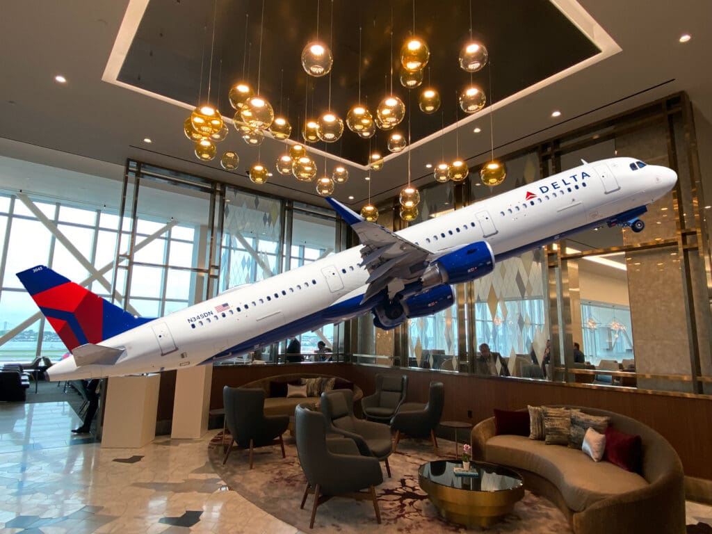 A Delta Air Lines A321 superimposed over a Delta Sky Club