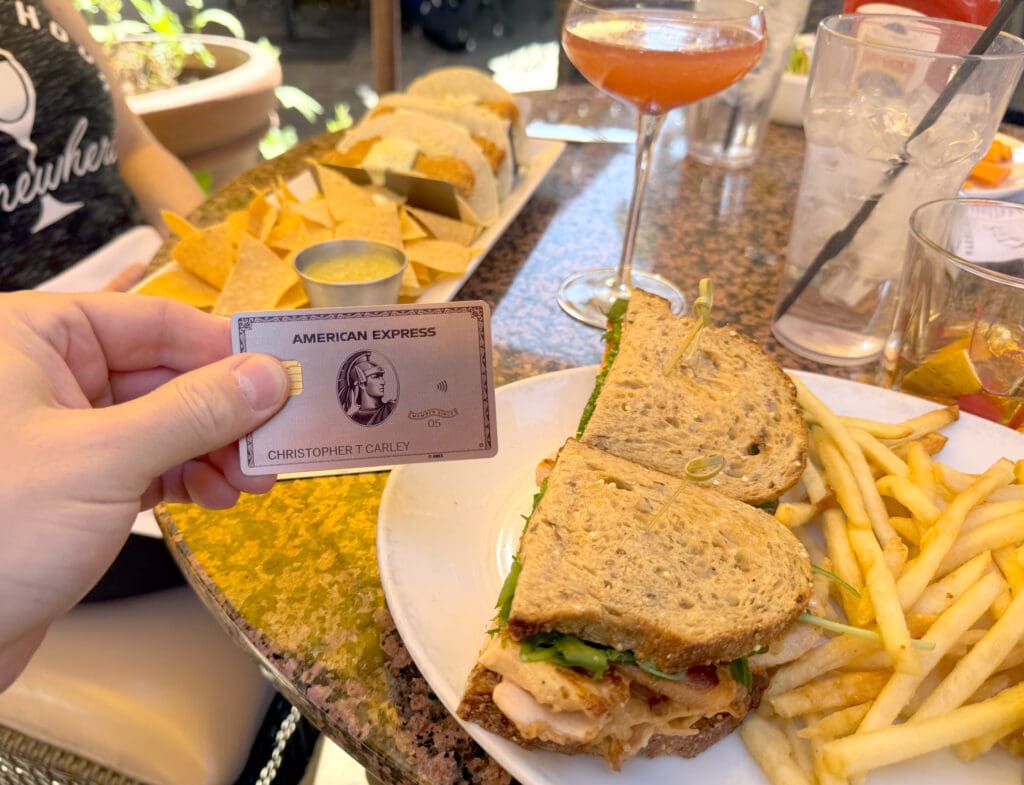 Using an American Express® Gold Card to pay a bill at Marmalade Cafe in Calabasas, CA.