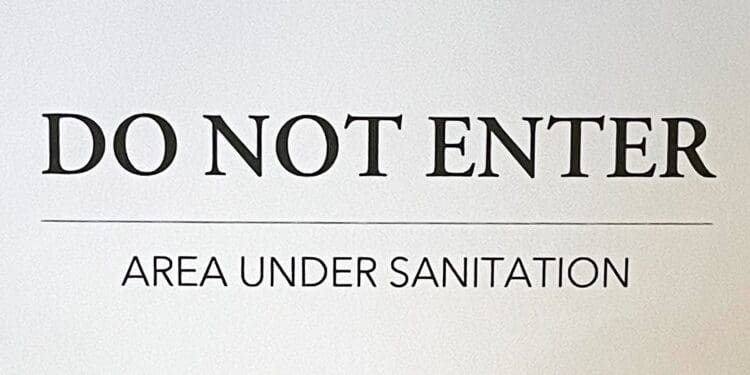 a sign with black text