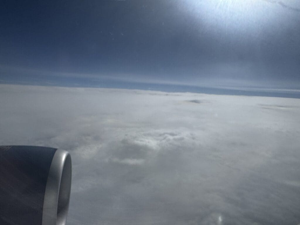 Clouds are seen from the air during a Delta Air Lines flight to Daniel K. Inouye International Airport in Honolulu, Hawaii from Boston (BOS).