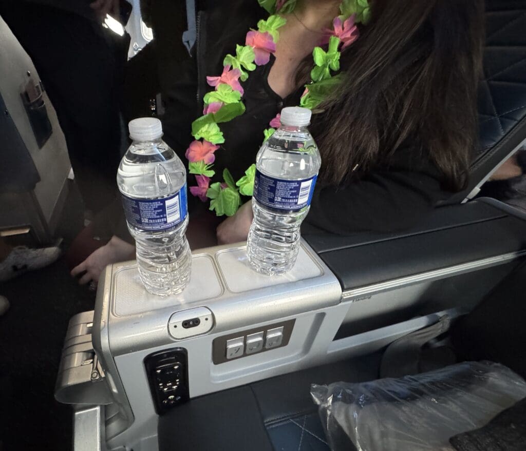 Bottles of water await Delta Premium Select passengers before a flight from Boston (BOS) to Honolulu (HNL).