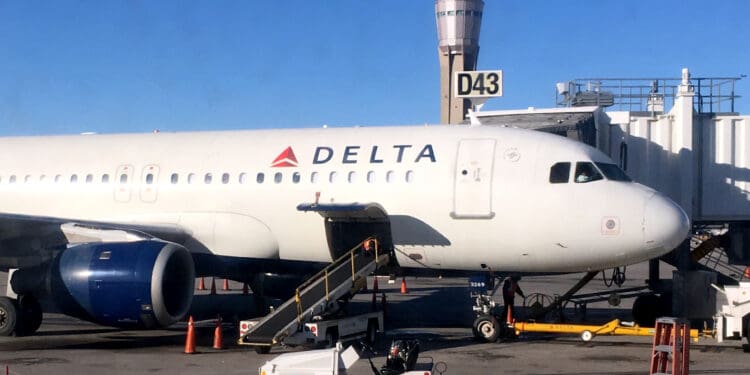 The cargo door of a Delta Air Lines A320 plane is open at Las Vegas International Airport (LAS)