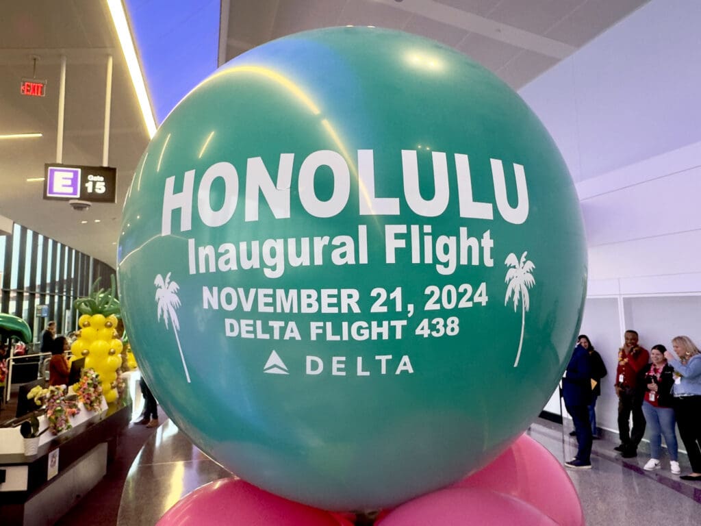 A commemorative balloon with the details of Delta flight 438 is displayed during the party for Delta Air Lines’ inaugural flight from Boston (BOS) to Honolulu (HNL) at Boston Logan International Airport on Thursday, November 21, 2024.