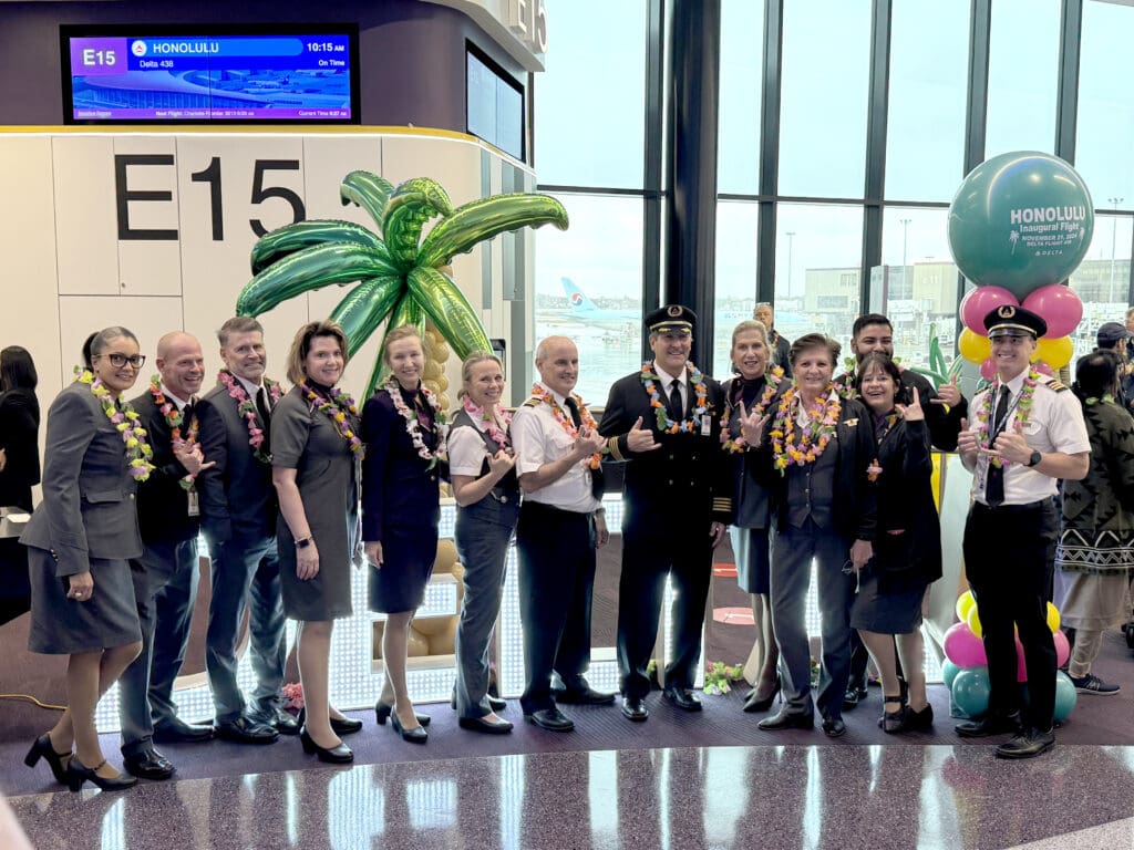 Flight and cabin crew of Delta Air Lines flight 437 pose for pictures during the party for Delta Air Lines’ inaugural flight from Boston (BOS) to Honolulu (HNL) at Boston Logan International Airport on Thursday, November 21, 2024. (©Eye of the Flyer)