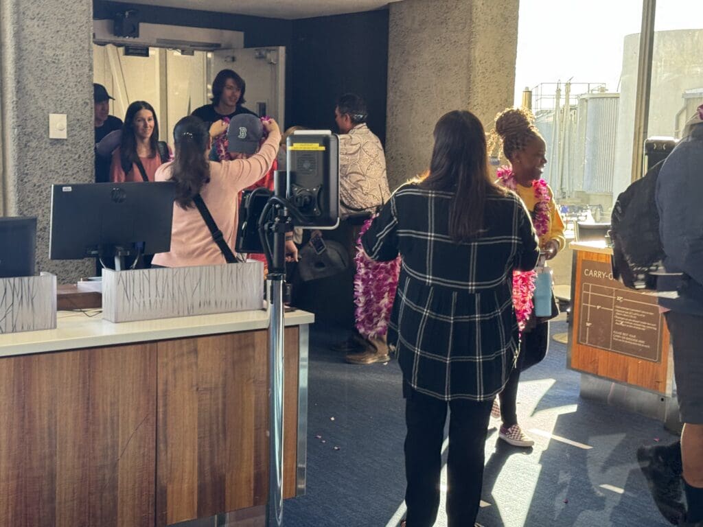 Passengers are greeted with leis upon entering the terminal at Daniel K. Inouye International Airport in Honolulu, Hawaii (HNL) after Delta Air Lines' inaugural flight from Boston (BOS) to Oahu.