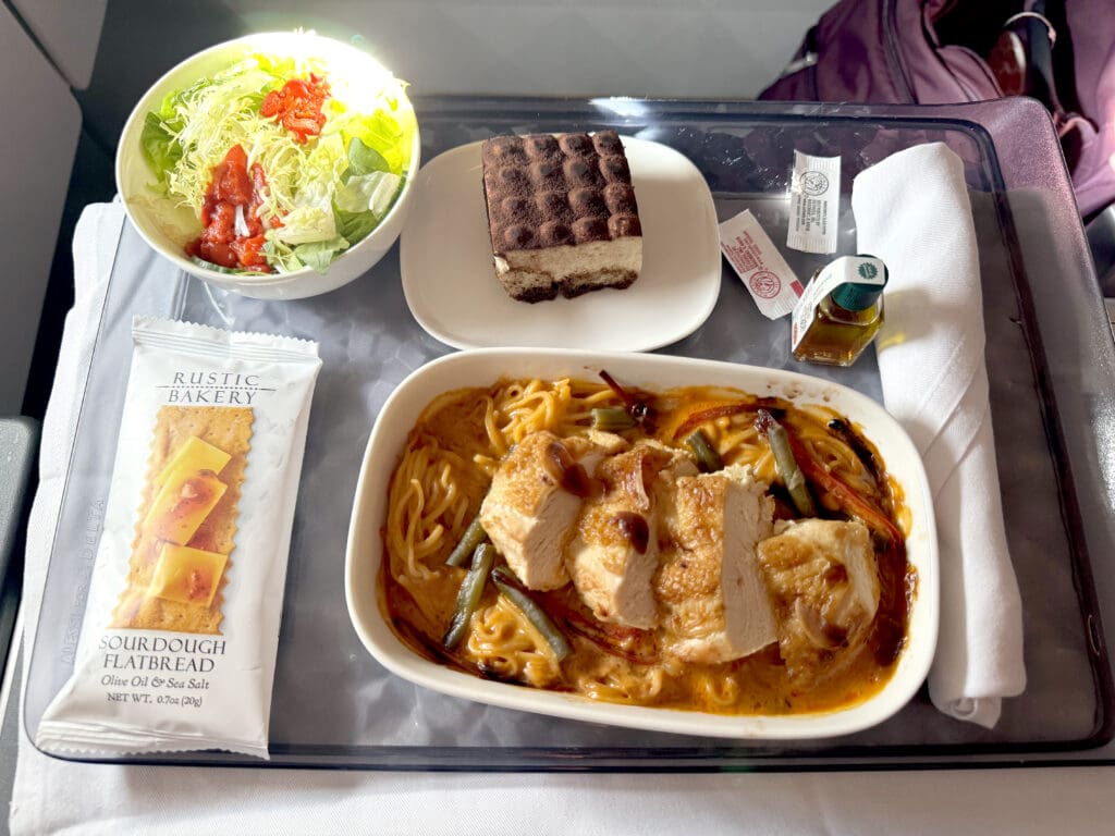 The Chicken Breast with Red Coconut Sauce Meal served in Delta One and Delta Premium Select