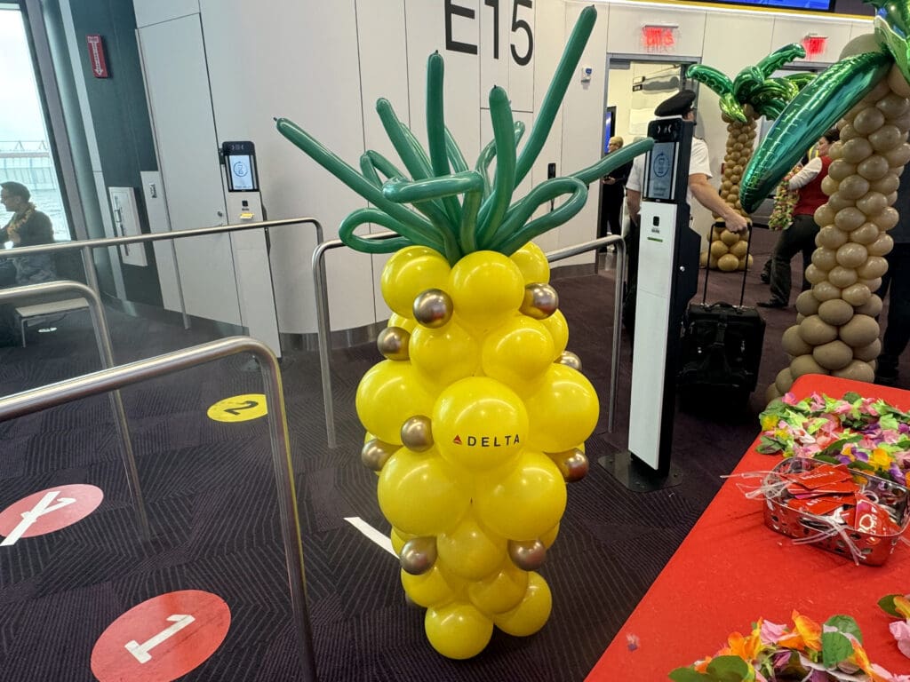 A pineapple balloon with Delta Air Lines branding is displayed during the party for Delta Air Lines’ inaugural flight from Boston (BOS) to Honolulu (HNL) at Boston Logan International Airport on Thursday, November 21, 2024.