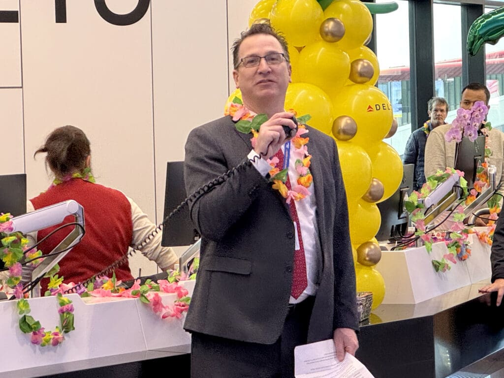 A Delta Air Lines representative speaks during the party for Delta Air Lines’ inaugural flight from Boston (BOS) to Honolulu (HNL) at Boston Logan International Airport on Thursday, November 21, 2024.