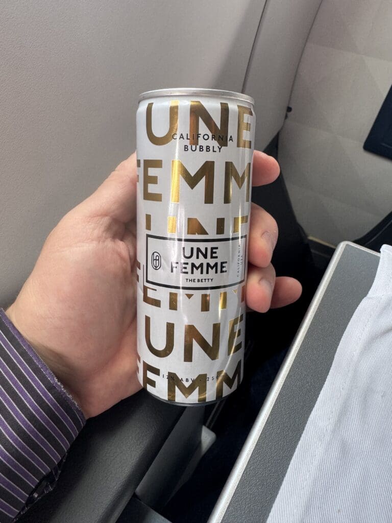 Une Femme sparking wine served during a flight from Boston (BOS) to Honolulu (HNL)