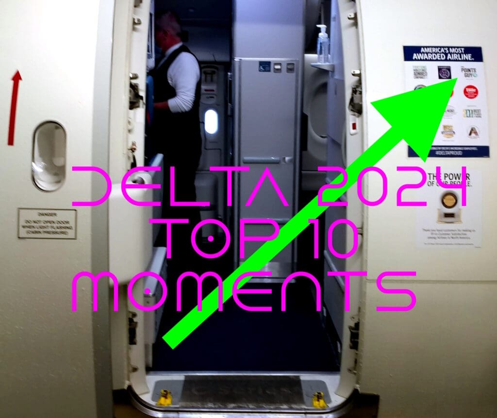 The image shows the open door of an airplane with a view into the cabin. A person is visible inside, wearing a uniform. On the right side, there is a poster titled "America's Most Awarded Airline." Overlaid on the image is large, bright pink text reading "DELTA 2021 TOP 10 MOMENTS," with a green arrow pointing to the poster.