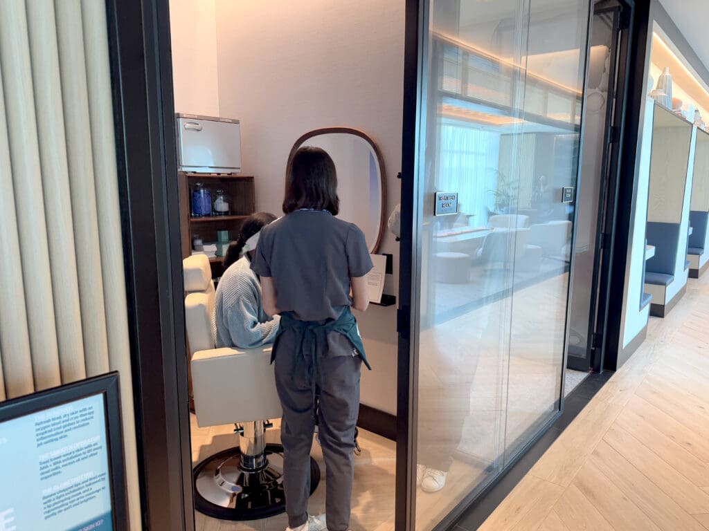 A guest receives a facial treatment inside the Chase Sapphire Lounge by The Club at the San Diego International Airport (SAN)