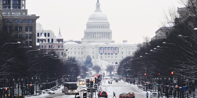 View down Pennsylvania Avenue to the United States Capitol during a winter snow storm.