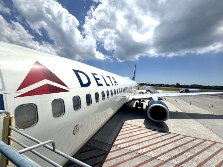 A Delta Air Lines Boeing 737-900ER is seen at Owen Roberts International Airport on Grand Cayman (GCM).