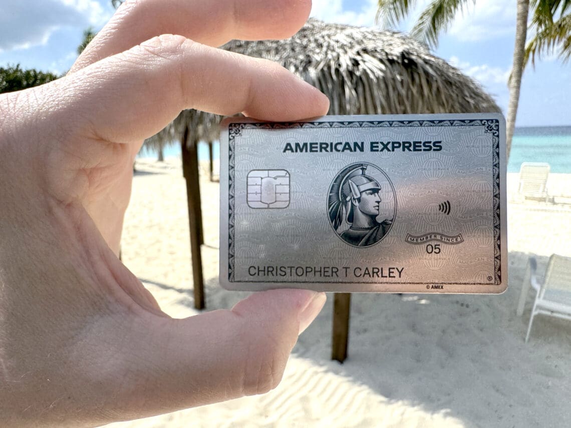 The American Express Platinum Card® card is seen on a beach in Grand Cayman (©Chris Carley for Eye of the Flyer)