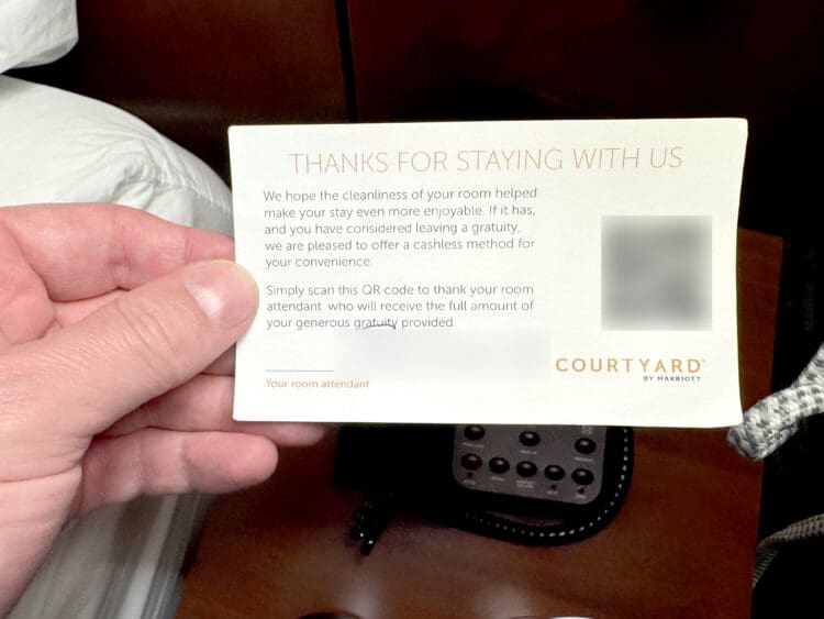A gratuity card with a QR code at a Marriott