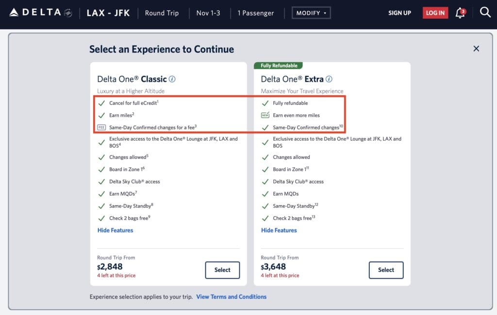 The image is a screenshot of a flight booking page from Delta, showing two options for a round trip from LAX to JFK. The options are "Delta One Classic" and "Delta One Extra." Each option lists features such as cancellation policies, earning miles, lounge access, and baggage allowances. The "Delta One Classic" option is priced at $2,848, while the "Delta One Extra" is priced at $3,648. Both options have a "Select" button, and certain features are highlighted with checkmarks or a "FEE" label.