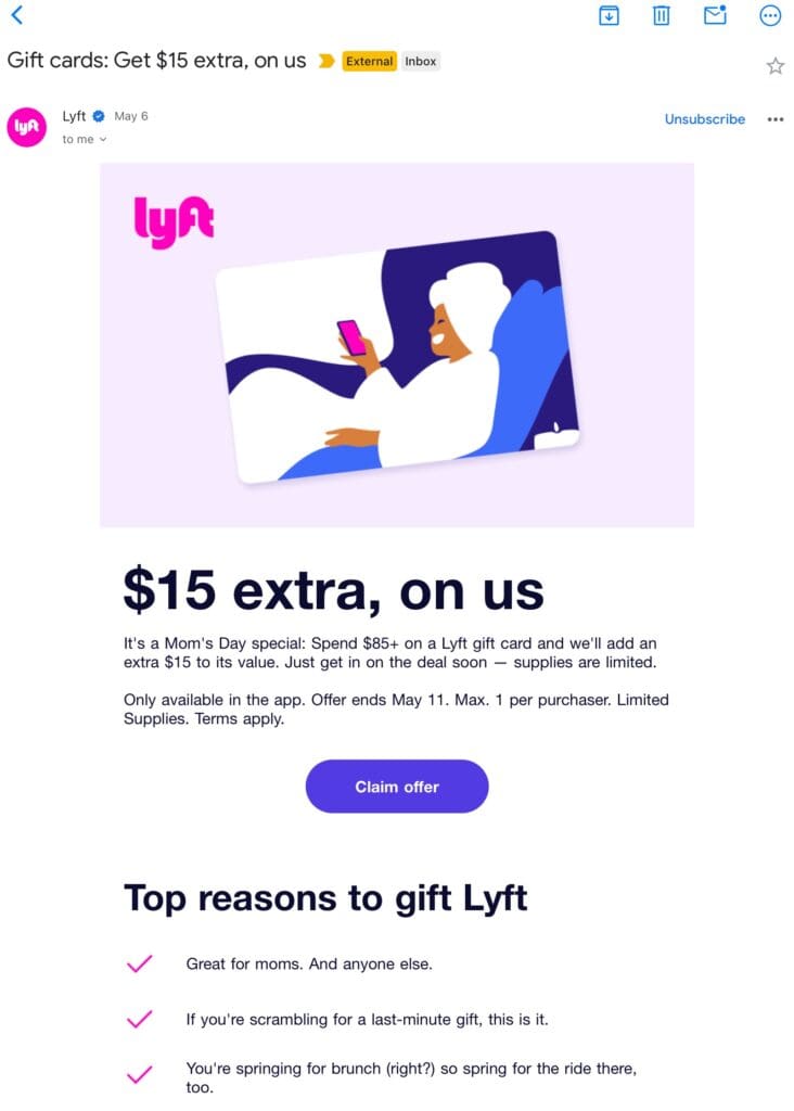 The image is an email advertisement from Lyft. It features a graphic of a person relaxing in a robe, holding a smartphone, with the Lyft logo in the top left corner. The text promotes a Mother's Day special offer: spend $85 or more on a Lyft gift card and receive an extra $15. The offer is available only in the app and ends on May 11. There is a purple button labeled "Claim offer." Below, there are reasons listed for gifting Lyft, such as being great for moms and as a last-minute gift option.