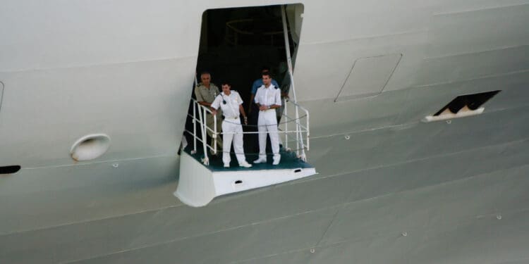 St. Thomas, US Virgin Islands - February 26, 2006: Crew members prepare as the Golden Princess, part of Princess Cruise Lines, sets sale from port in Charlotte Amalie