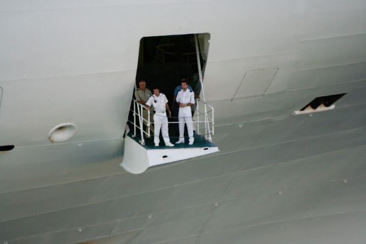 St. Thomas, US Virgin Islands - February 26, 2006: Crew members prepare as the Golden Princess, part of Princess Cruise Lines, sets sale from port in Charlotte Amalie