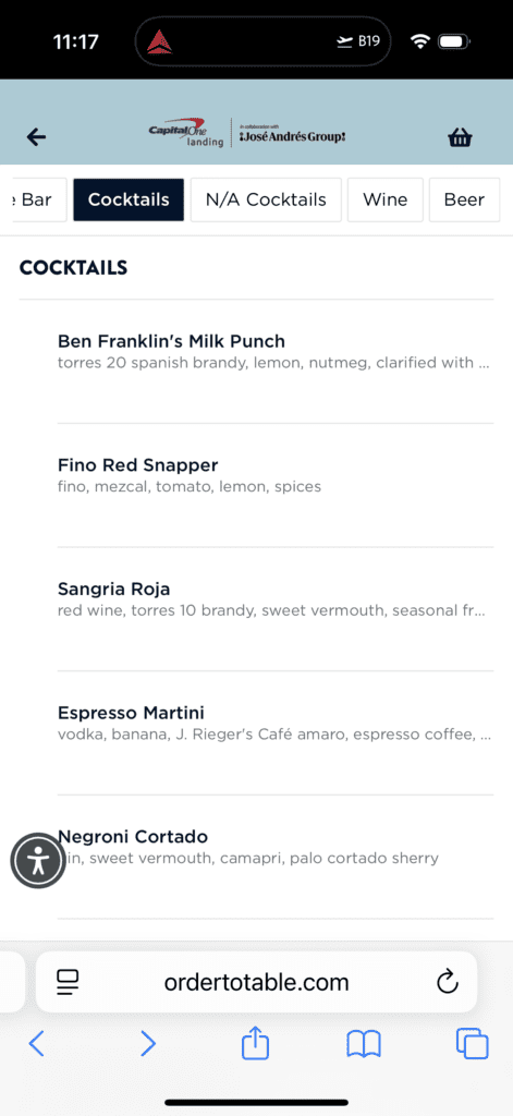 The image shows a menu from a website, featuring a list of cocktails. The cocktails listed are: 1. Ben Franklin’s Milk Punch - Ingredients include Torres 20 Spanish brandy, lemon, nutmeg, and clarified milk. 2. Fino Red Snapper - Ingredients include fino, mezcal, tomato, lemon, and spices. 3. Sangria Roja - Ingredients include red wine, Torres 10 brandy, sweet vermouth, and seasonal fruit. 4. Espresso Martini - Ingredients include vodka, banana, J. Rieger’s Café amaro, espresso coffee, and other components. 5. Negroni Cortado - Ingredients include gin, sweet vermouth, Campari, and Palo Cortado sherry. The menu is part of a collaboration with José Andrés Group and is accessible via the website "ordertotable.com".