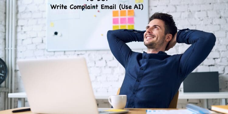 A man is sitting at a desk with a laptop and a cup of coffee, leaning back in his chair with his hands behind his head, smiling. Behind him is a whiteboard with sticky notes and the text "TO DO: Write Complaint Email (Use AI)" written on it. The setting appears to be a modern office with a brick wall.