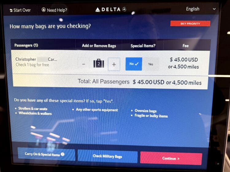 A Delta Air Lines check in kiosk asking a passenger to pay $45 or 4,500 SkyMiles for their second bag.