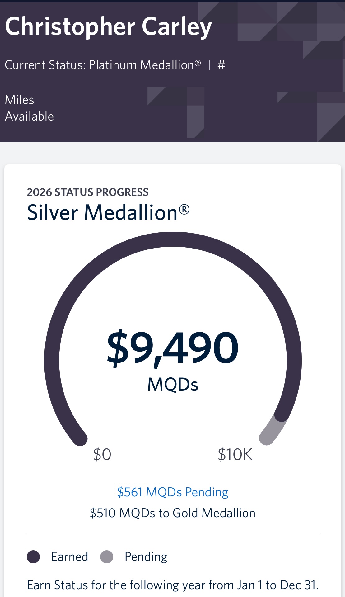 The image is a screenshot of a loyalty program status page for a person named Christopher Carley. It shows the current status as "Platinum Medallion®" and the 2026 status progress towards "Silver Medallion®." The progress bar indicates $9,490 MQDs earned, with a goal of $10,000. There are $561 MQDs pending, and $510 MQDs are needed to reach Gold Medallion® status. A legend shows dark circles for "Earned" and light circles for "Pending." The note at the bottom states that status is earned for the following year from January 1 to December 31.