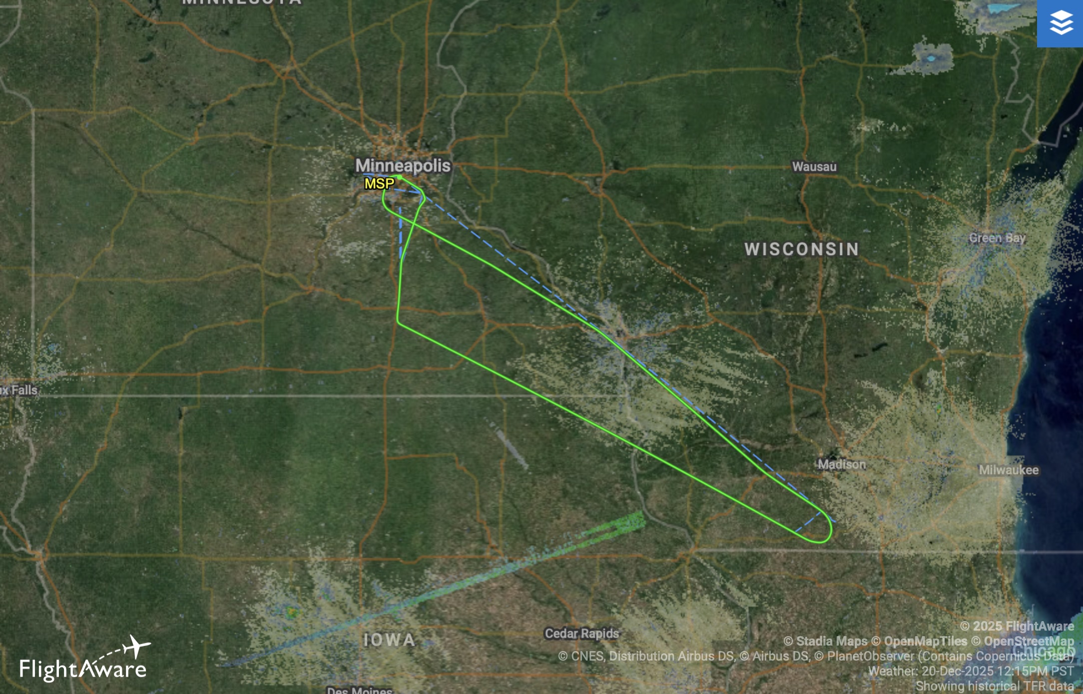 The image is a flight path map from FlightAware showing a route over parts of Minnesota, Wisconsin, and Iowa. The path starts and ends in Minneapolis, marked as MSP, and forms a triangular shape extending southeast towards Madison, Wisconsin, and then southwest towards Iowa before returning to Minneapolis. The map includes city labels like Minneapolis, Madison, and Milwaukee, and state labels for Minnesota, Wisconsin, and Iowa. This was the Minnesota Vikings' charter flight headed to Newark